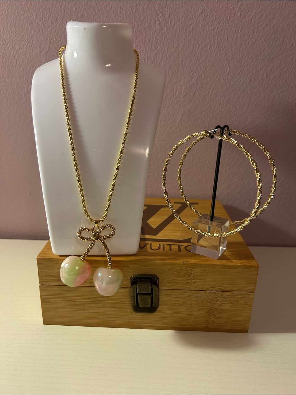 Gold-Tone Bow Necklace with Iridescent Pink-Green Pendant w/gold hoop earrings.